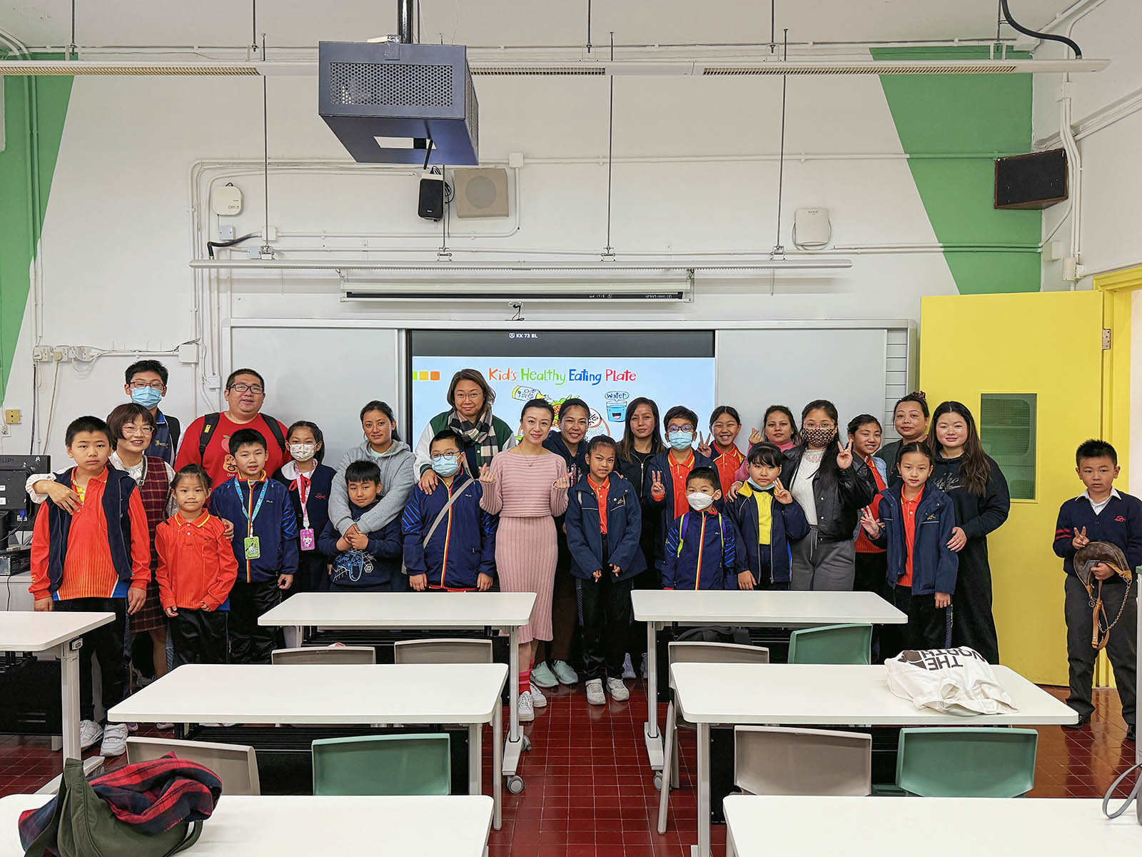 Mellissa Cheung with students and parents after a child nutrition talk at a Po Leung Kuk school